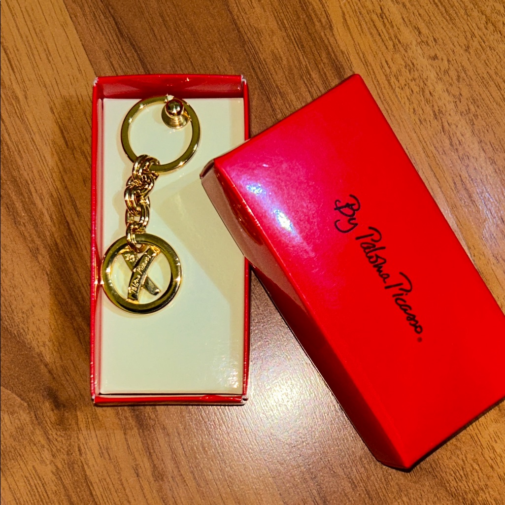 Brand New In Box Paloma Picasso Gold Tone Logo Keychain Brand New In Box Paloma Picasso Gold Tone Logo Keychain